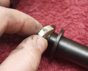 close up of the small RA nut being removed