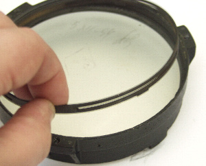 The TAL mirror cell tension spring