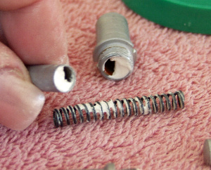 The spring pushers and pistons being greased