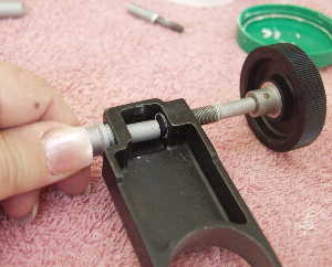 Apring pusher being replaced into the slow motion control