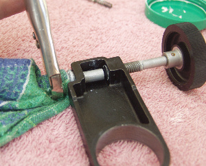 Tighetning down the spring pusher assembly