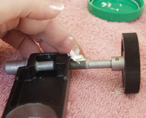 regreasing the slow motion control spindles